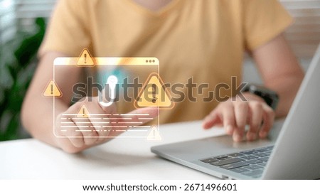 Web phishing and cyber attack warning concept with man using laptop, digital alert icon and exclamation sign representing online scam, fraud detection, and internet security risk.