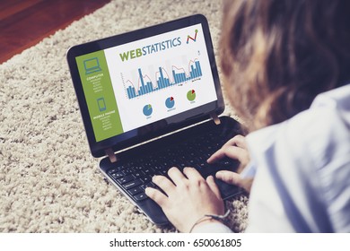 Web statistics in a laptop computer screen. Woman analyzing web traffic.