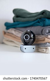 Webcam Hidden In A Stack Of Clothes For Covert Surveillance Of The House. Surveillance And Security Systems. Smart House. Espionage. Hidden Camera For Watching