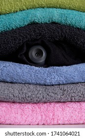 Webcam Hidden In A Stack Of Clothes For Covert Surveillance Of The House. Surveillance And Security Systems. Smart House. Espionage. Hidden Camera For Watching