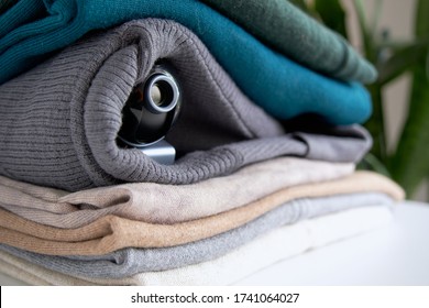 Webcam hidden in a stack of clothes for covert surveillance of the house. Surveillance and security systems. Smart House. Espionage. Hidden camera for watching