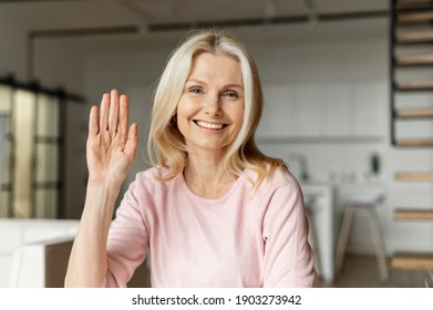 Webcam View Of A Charming Blonde Mid Age Women Having Video Conference, A Cheerful Female Waving Into Camera And Smiles, Virtual Meeting Concept, Video Call To Employee, Coworker, Friend