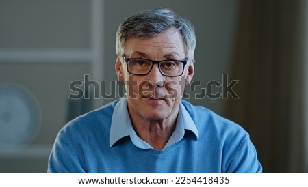 Webcam view old businessman serious conversation talk, distant meeting disagree reject reaction mature man looking at camera talking online senior old 60s male teacher in glasses video class lesson