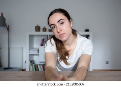 Webcam View Of Young Female Student Paying Attention To Online Class