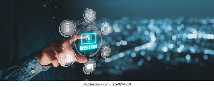 Webinar e-learning training business internet technology concept. Person hand toucing VR screen webinar icon on blue bokeh background.
