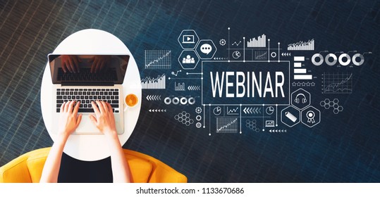 Webinar with person using a laptop on a white table - Shutterstock ID 1133670686