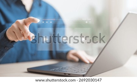 webinar, slide, deck, presentation, training, Person using a laptop with holographic media controls, representing an online webinar, digital training session, and modern e-learning presentation.