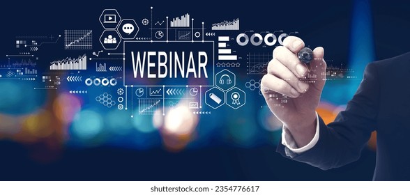 Webinar theme with businessman in a city at night - Shutterstock ID 2354776617