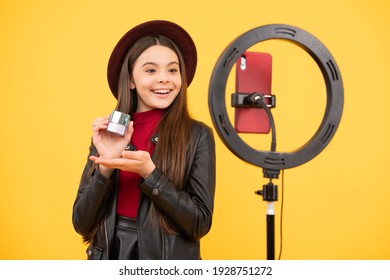 weblog and vlog. makeup tutorial. influencer. happy teen girl use selfie led. kid beauty blogger. childhood happiness. cheerful child do makeup. vlogger with cosmetics. make video blog on smartphone.