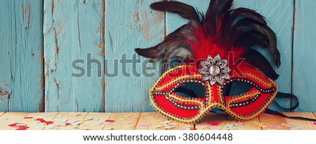 website banner background of colorful Venetian masquerade mask. selective focus. vintage filtered