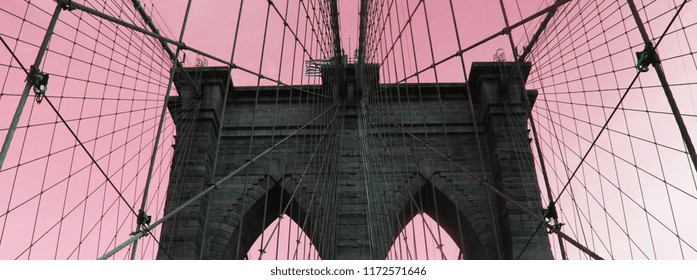 Website banner of Brooklyn bridge in pink background. Concept of New York blog header and American landmarks and cheap tours to USA.