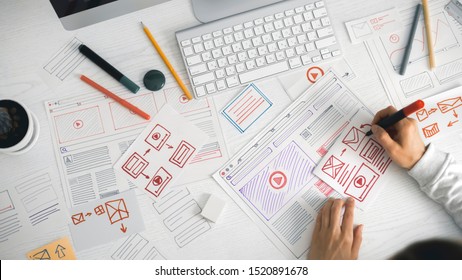 Website designer creates a sketch application. Developing a project drawing an interface mockup.