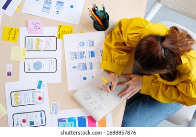 Website Designer, Creative Planning Phone App Development Sketch Template Layout Framework Wireframe Design, User Experience Concept, Overhead View Of Young Woman UX Designer Web Structure At Home 