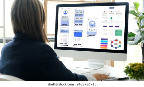 Website designer, Creative planning phone app development template layout framework wireframe design, User experience concept, Young asian woman UX designer working on smartphone application at office - Powered by Shutterstock