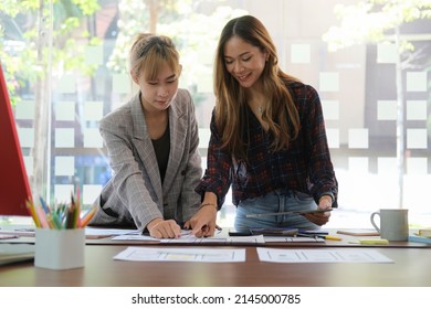 Website Designer Team Are Planning Application Development Draft Sketch Drawing Template Layout Framework Wireframe At Modern Office.