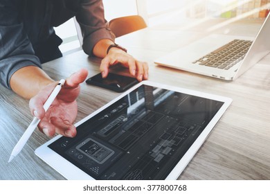 Website Designer Working Digital Tablet And Computer Laptop And Graphics Design Diagram On Wooden Desk As Concept