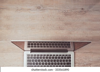 Website header design with laptop computer on office desk. View from above