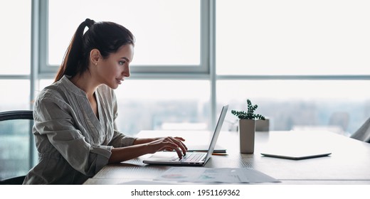 Website Header Of Portrait Of Gorgeous, Smiling Young Female Using Laptop Computer At Workplace. Side View