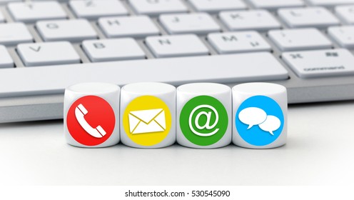 Website und Internet kontaktieren uns Seitenkonzept mit roten, gelben, grünen und blauen Symbolen auf Würfeln vor einer Tastatur