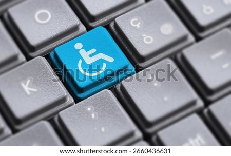 Website and internet online content accessibility and accessible computing or assistive technology for individuals with disabilities concept with a wheelchair icon and symbol on a computer key.