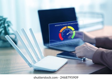 Website speed optimization. Man using laptop at table, closeup. Virtual screen over device - Powered by Shutterstock