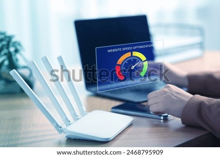 Website speed optimization. Man using laptop at table, closeup. Virtual screen over device