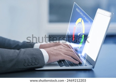Website speed optimization. Man using laptop at table, closeup. Virtual screen over device