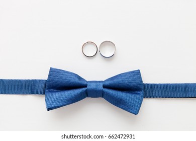 Wedding Accessories - Gold Wedding Rings And Bowtie Of The Groom