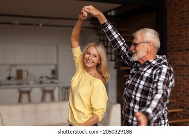 Wedding Anniversary. Happy Mature Couple Dancing At Home. A Romantic Date With Older People.