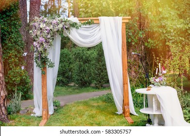 wedding arch in the style of rustic pine summer park