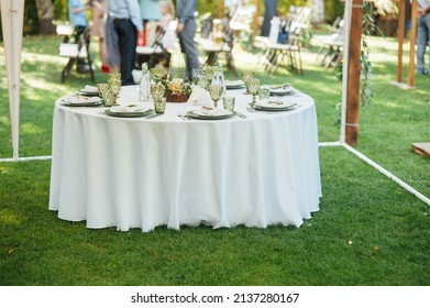 Wedding. Banquet. The Chairs And Round Table For Guests, Served With Cutlery.