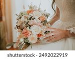 Wedding bouquet. Beige flowers. Wedding day. Bride