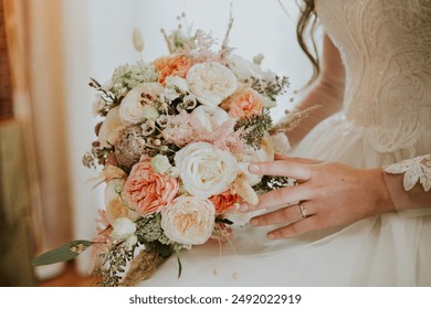 Wedding bouquet. Beige flowers. Wedding day. Bride