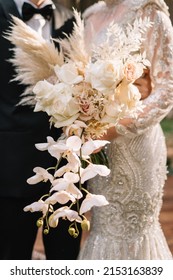wedding bouquet of the bride, boho style, outdoor, dry flowers
