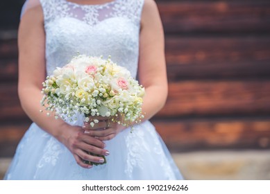Wedding bouquet. in bride holding in hand bouquet.