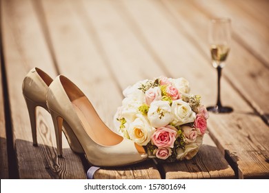 Wedding bouquet and bride shoes