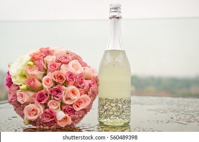 Wedding Bouquet And  Champagne Bottle
