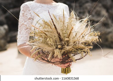 Wedding Bouquet With Dried Flowers And Spikelets Boho Style In Brides Hands