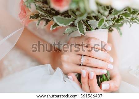 Wedding bouquet of flowers in brides' hands