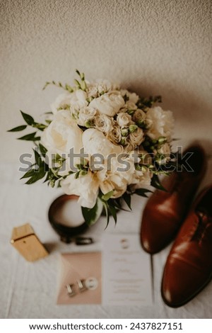 wedding bouquet with groom's details