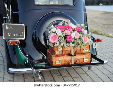 Wedding bouquet on vintage wedding car - Shutterstock ID 347935919