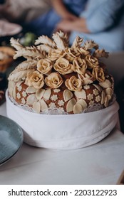 Wedding bread - loaf (cake). Wedding bread. A loaf is decorated with flowers, stables, ears of dough. Wedding. Bride and groom. Ukrainian tradition - Shutterstock ID 2203122923