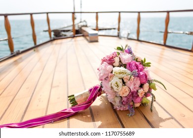 Wedding. Bridal bouquet on a background winch on a yacht. the bride's bouquet