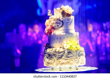 wedding bridal cake at the wedding surrounded by colorful show lights