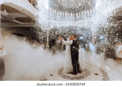 the wedding of the bride and groom in an elegant restaurant with great light and atmosphere. The first dance of the bride and groom. - Powered by Shutterstock