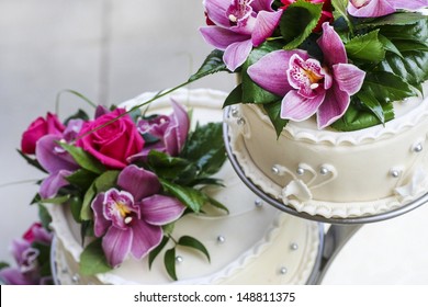 Wedding Cake Decorated With Stunning Purple And Pink Orchids