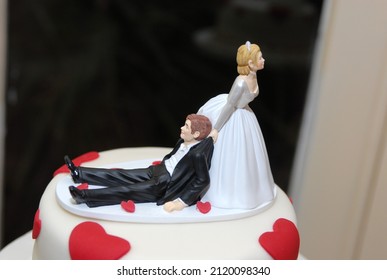 Wedding cake decoration figure of bride and groom. Top of cake ornament.