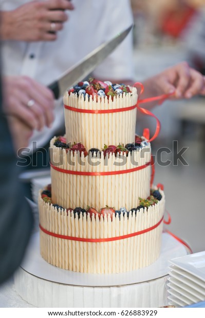 Wedding cake is divided into\
shares.