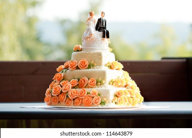 Wedding cake with figurines. - Powered by Shutterstock