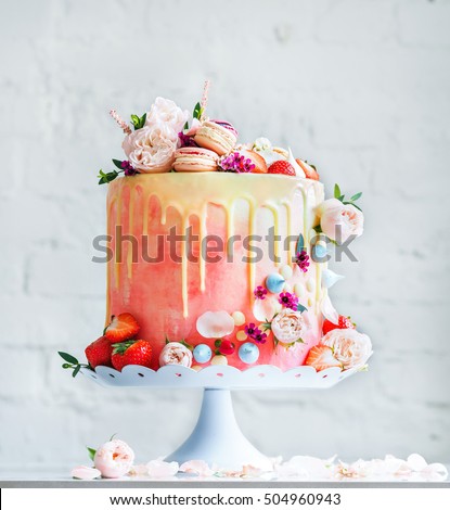 Wedding cake with flowers macarons and blueberries